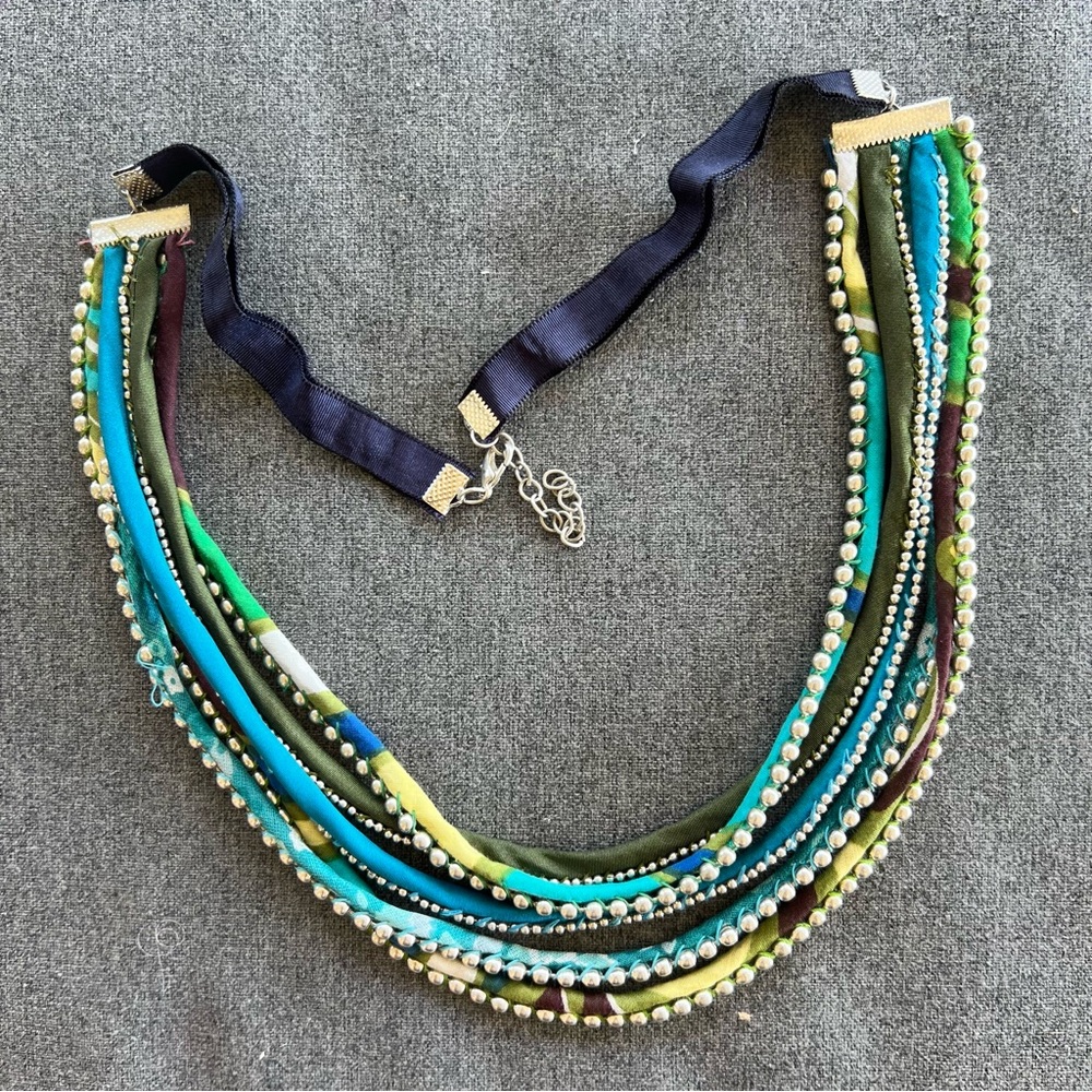 Multi-strand necklace with fabric and silver-toned beads 28” Long